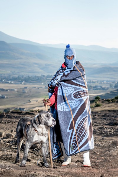 Lesotho herder wrapped in tribal blanket