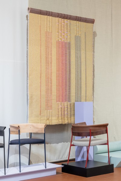 Woven wall panels with metal and paper tape yarn